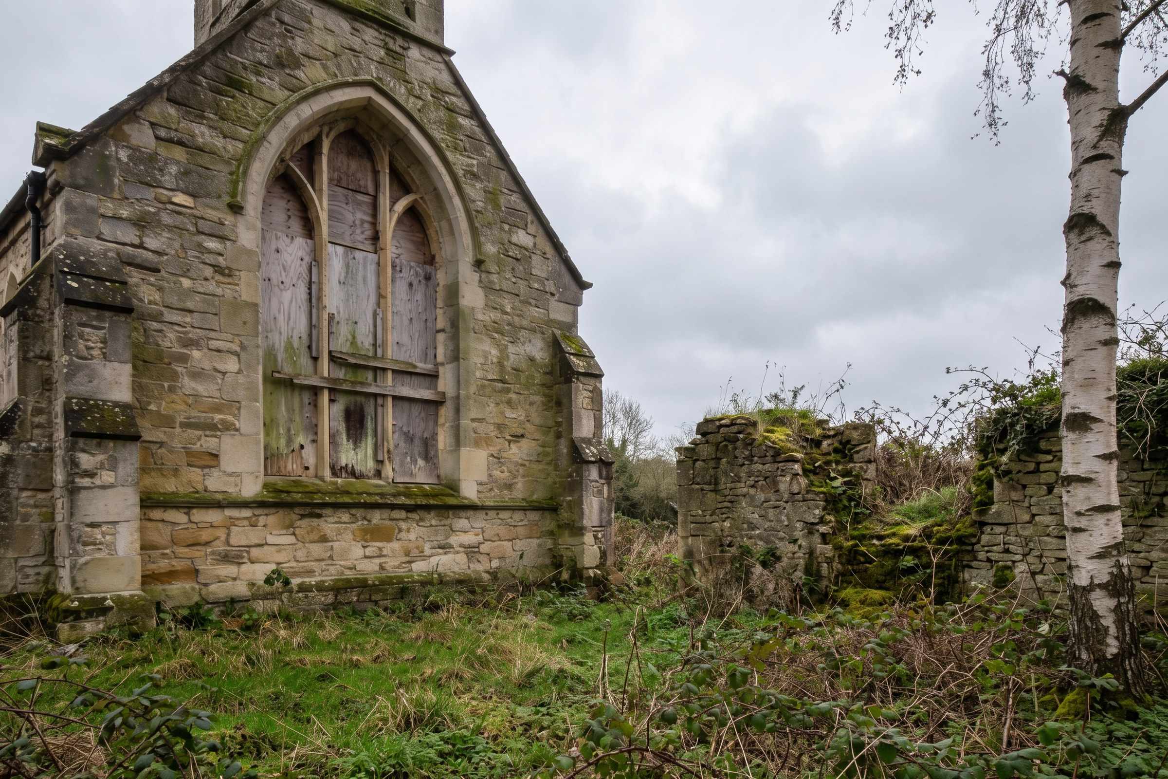 Before: the stone chapel with its arched window boarded up, moss on the stone and brambles by a crumbling wall